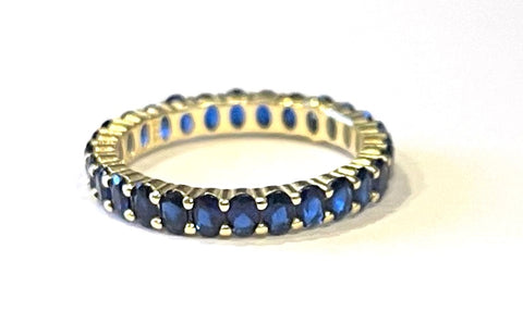 Vermeil over sterling silver eternity band with sapphire colored cz stones