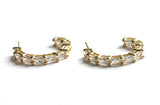 Vermeil over sterling silver hoops with emerald cut cz's. 