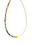 1/2 rainbow beaded, 1/2 beaded synthetic pearls with smiley face bead in the middle necklace.
