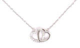Sterling silver chain necklace with a cubic zirconia interlocking heart pendant.