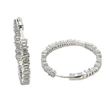 Sterling silver cubic zirconia staggered stones inside out hoop earrings. 