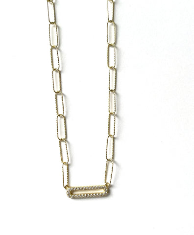 Vermeil over sterling silver paperclip chain with a cz open bar .