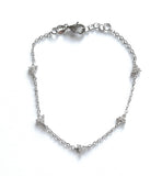 Sterling silver bracelet with five cz clusters.