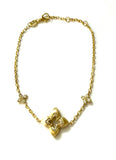 Vermeil over sterling silver chain bracelet with small cz clovers on the side and a center brushed gold and cz clover.
