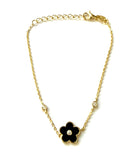 Vermeil over sterling silver chain bracelet with a black enamel flower with cubic zirconia stones.
