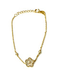 Vermeil over sterling silver chain bracelet with a mother of pearl flower with cubic zirconia stones.