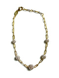 Vermeil over sterling silver paperclip chain bracelet with five cz cluster flowers.