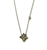 Sterling silver chain necklace with an Open Mother Of Pearl Clover Burst Outlined in Diamond Shape.