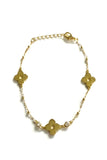 Vermeil over sterling beaded and chain bracelet with  three clovers.  There are also two cubic zirconia small bezel stones. 
