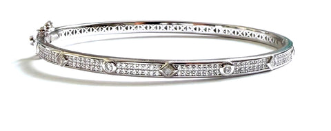Sterling silver cubic zirconia bangle with alternating  diamond and round cubic zirconia stones.