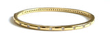 Vermeil over sterling silver bangle with small round cz stones going around the bangle.