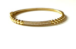 Vermeil over sterling silver beaded bangle bracelet with a cz bar.