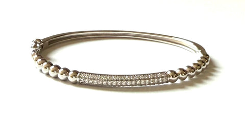 Sterling silver beaded bracelet with a cz bar.