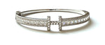 Sterling silver "H" bangle bracelet with princess and round cz stones.