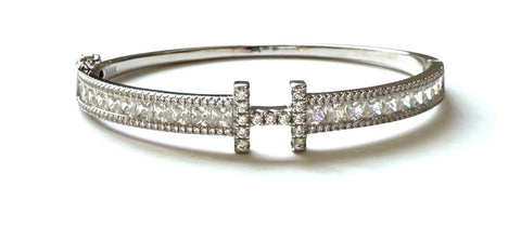 Sterling silver "H" bangle bracelet with princess and round cz stones.