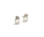 Sterling silver emerald shaped stud earrings with cubic zirconia stones.