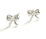 Sterling silver bow studs with a cz in the middle.
