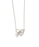Sterling silver chain necklace with a bow pendant.
