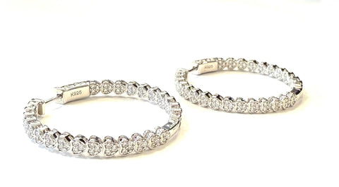 Sterling silver inside out cz heart shaped hoop earrings.