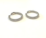 Sterling silver prong set cz inside out hoop earrings.