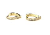 Vermeil over sterling silver oval huggie earrings with cubic zirconia stones.