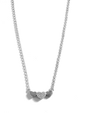 Sterling silver triple heart necklace.   The middle heart has cubic zirconia stones.