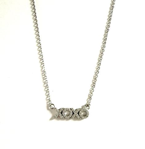 Sterling silver chain necklace with a cubic zirconia xoxo pendant necklace.