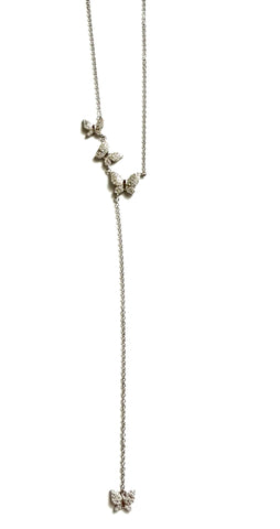 Sterling silver lariat necklace with three butterflies dropping into a chain and a single butterfly at the bottom.