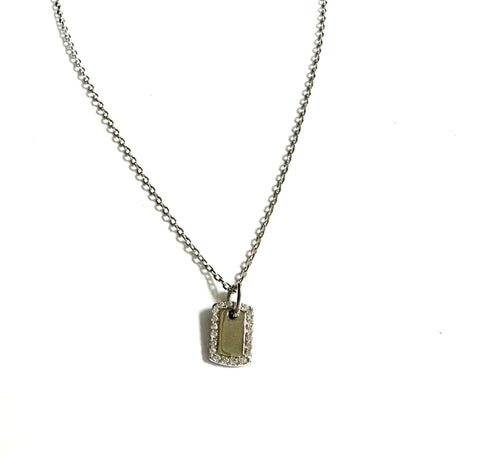 Sterling silver chain necklace with a mini dog tag pendant outlined in cubic zirconia stones.