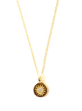 Vermeil over sterling silver chain necklace with a gold disc pendant and a cubic zirconia starburst in the disc.