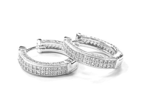 Sterling silver all sided pave cz hoop earrings.