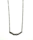 Sterling silver cz twisted bar necklace.