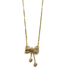 Vermeil over sterling silver silver chain necklace with a cubic zirconia bow and hanging bezel stones.