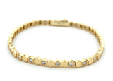 Vermeil over sterling silver octagon shaped alternating tennis bracelet with Moissanite stones.