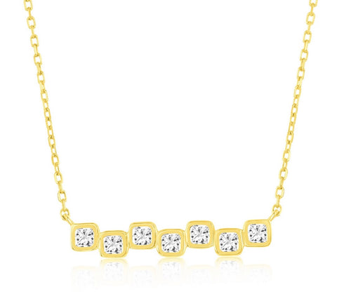 Vermeil over sterling silver cubic zirconia square bezel set bar necklace.