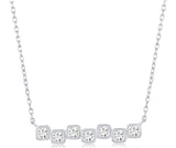 Sterling silver cubic zirconia square bezel set bar necklace.