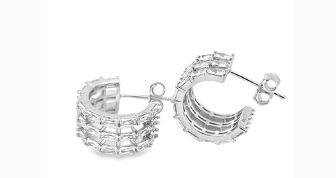 Sterling silver triple row huggie earrings with cubic zirconia baguette stones.