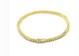 Vermeil over sterling silver 2mm CZ tennis bracelet with a spring lock clasp.