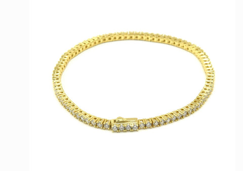 Vermeil over sterling silver 2mm CZ tennis bracelet with a spring lock clasp.