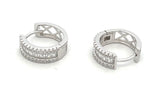 Sterling silver baguette and round cz huggie earrings.
