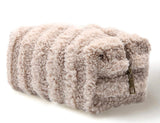 Tan striped sherpa makeup bag with a zipper closure.