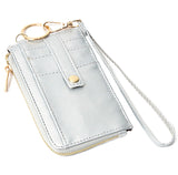 Silver basketweave faux leather wristlet with card holder and zip up wallet.     