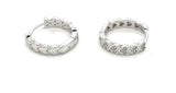 Sterling silver mini huggie earrings with pave cz hearts.