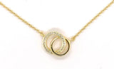 Vermeil over sterling silver necklace with a double circle pendant adorned with cubic zirconia stones, attached to a spring ring clasp.