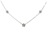 Sterling silver chain necklace with two small cz flowers on each side and a larger cz flower in the center.