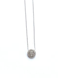 Sterling silver and cz pave disc with a hamsa in the middle of the disc.