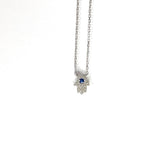 sterling silver cz mini hamsa necklace with a colored sapphire cz stone in the middle
