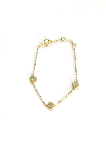 Vermeil over sterling silver chain bracelet with three cz  pave discs.