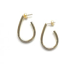 Vermeil over sterling silver elongated pear shaped hoops.